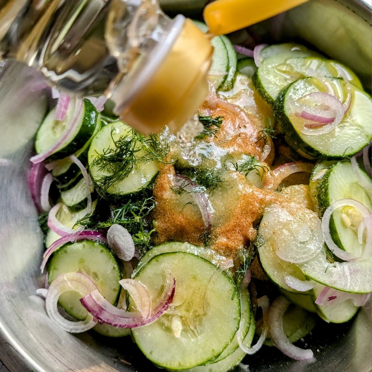 cucumber salad with rice wine vinegar poured in the bowl for the dressing.