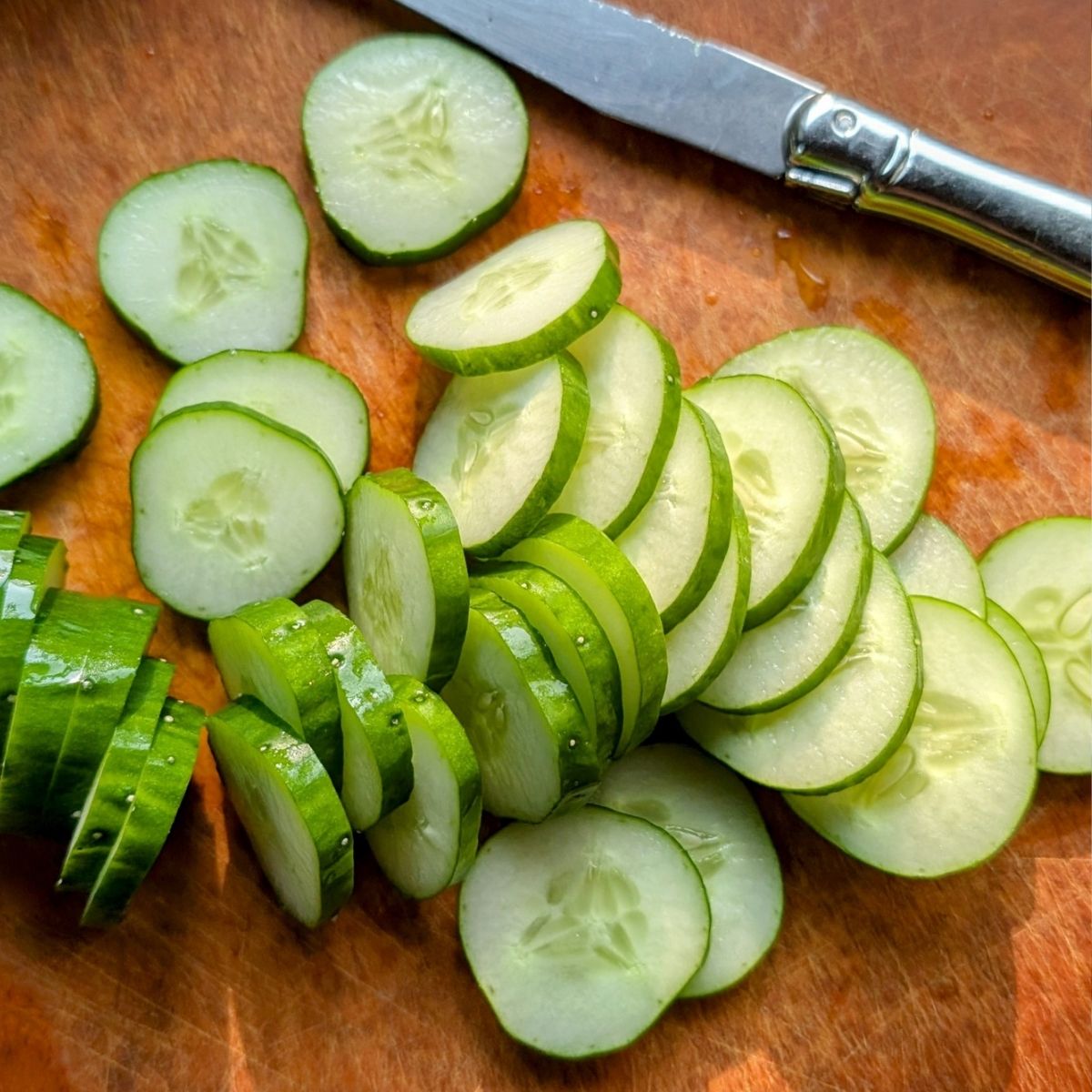 thinly sliced cucumbers for an old fashioned salad.