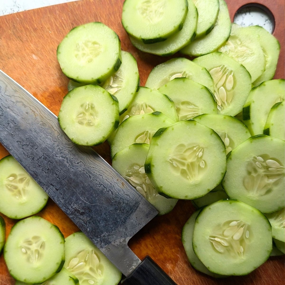 thinly sliced cucumbers for cucmber salad with sour cream sugar and dill