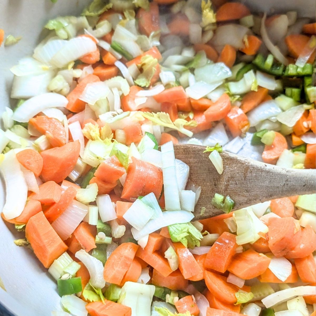 add carrots vegetables and fresh herbs to the pot.