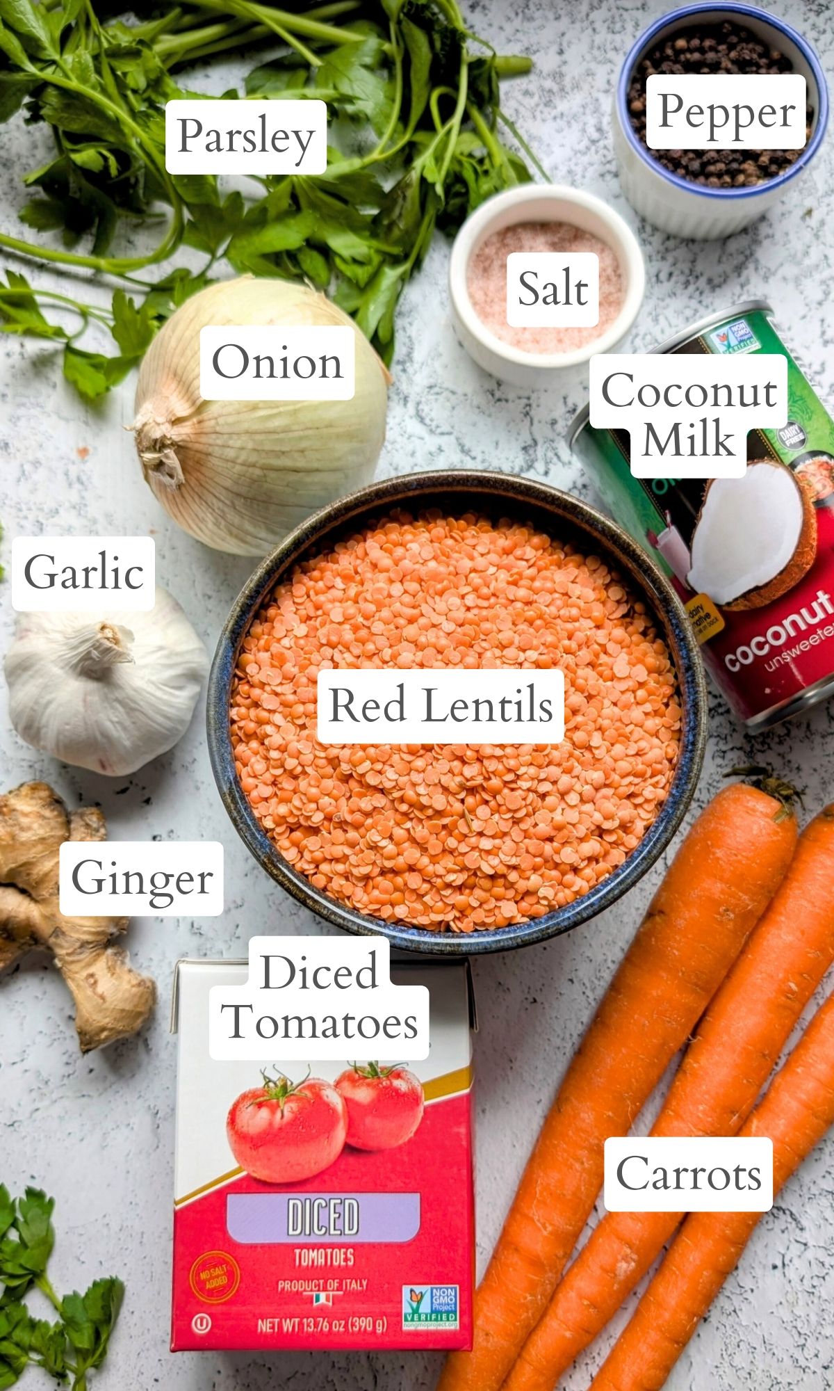 red lentil coconut milk soup recipe with onion garlic ginger root carrots tomatoes and garlic.