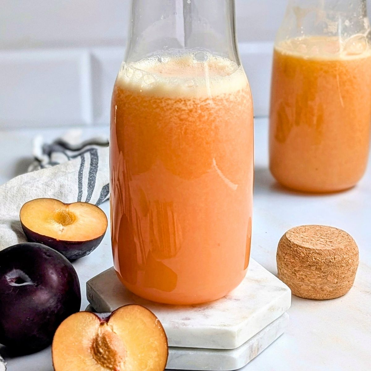 plum juicer recipe with apples and lime for a bright and tasty fresh juice recipe