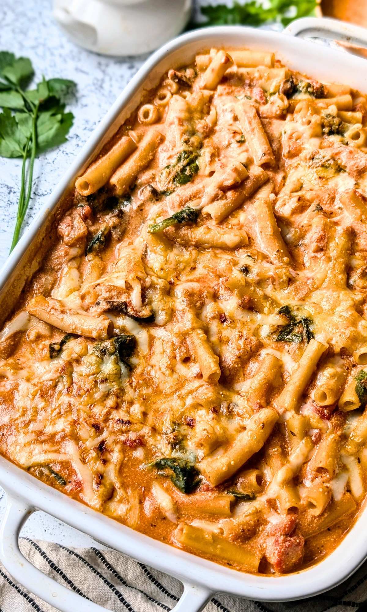 vegetarian meatless baked ziti with mushrooms and mozzarella with spinach and ricotta cheese.