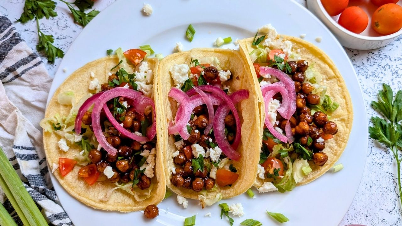 vegan chickpea tacos with flavorful toppings and barbecue sauce.