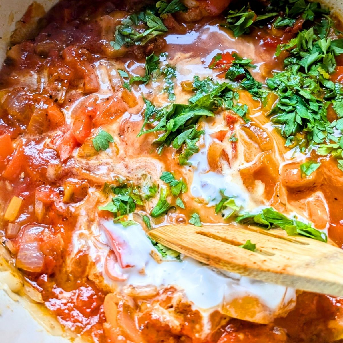 vegetarian creole pasta sauce with cream, parsley, tomatoes, peppers, and onions, waiting for pasta.