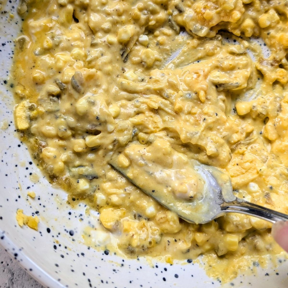 a fork mashed egg yolks for deviled egg filling made with ranch dressing and no mayonnaise.