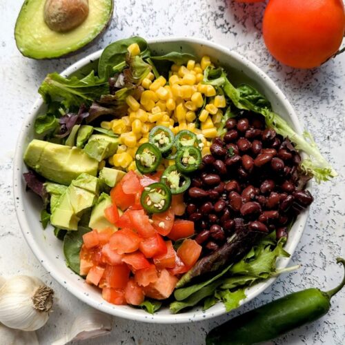 taco tuesday salad with avocado black beans corn red onion and a lime vinaigrette healthy spinach salads southwest dressing vegan vegetarian gluten free meatless side dishes with tacos