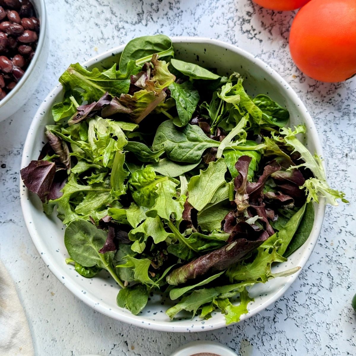 washed salad mix in a large bowl ready to make a tasty southwest salad.