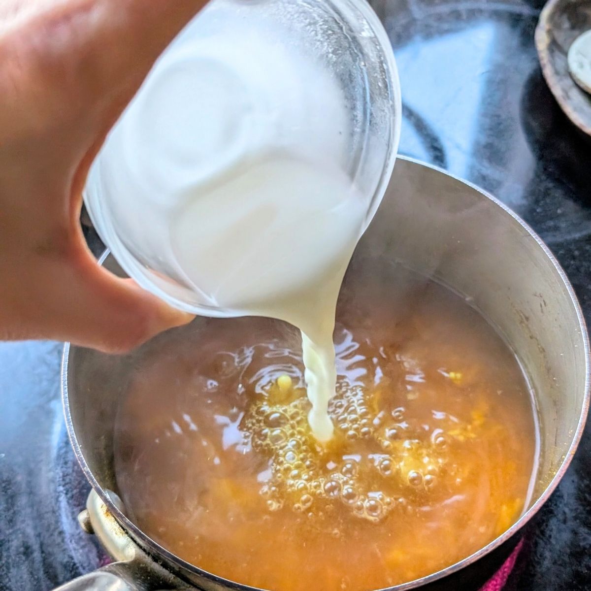 corn starch and water being added to egg drop soup to thicken it and also some rice