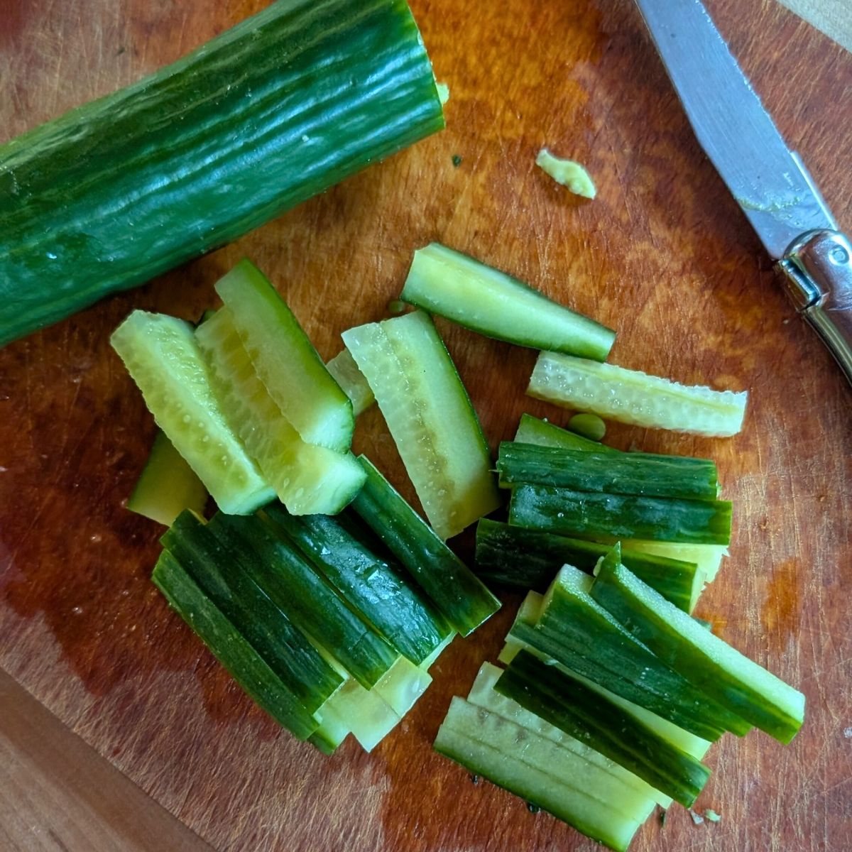 sliced cucumbers for udon noodle salad with sesame lime dressing.