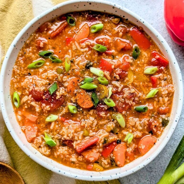 meatless stuffed pepper soup with rice tomatoes bell pepper and spices in a bowl with chiles