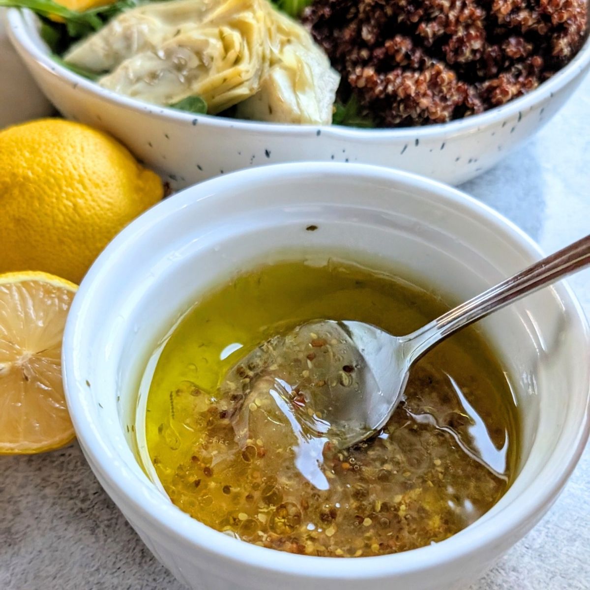 lemon vinaigrette dressing with olive oil, mustard, garlic, salt and pepper