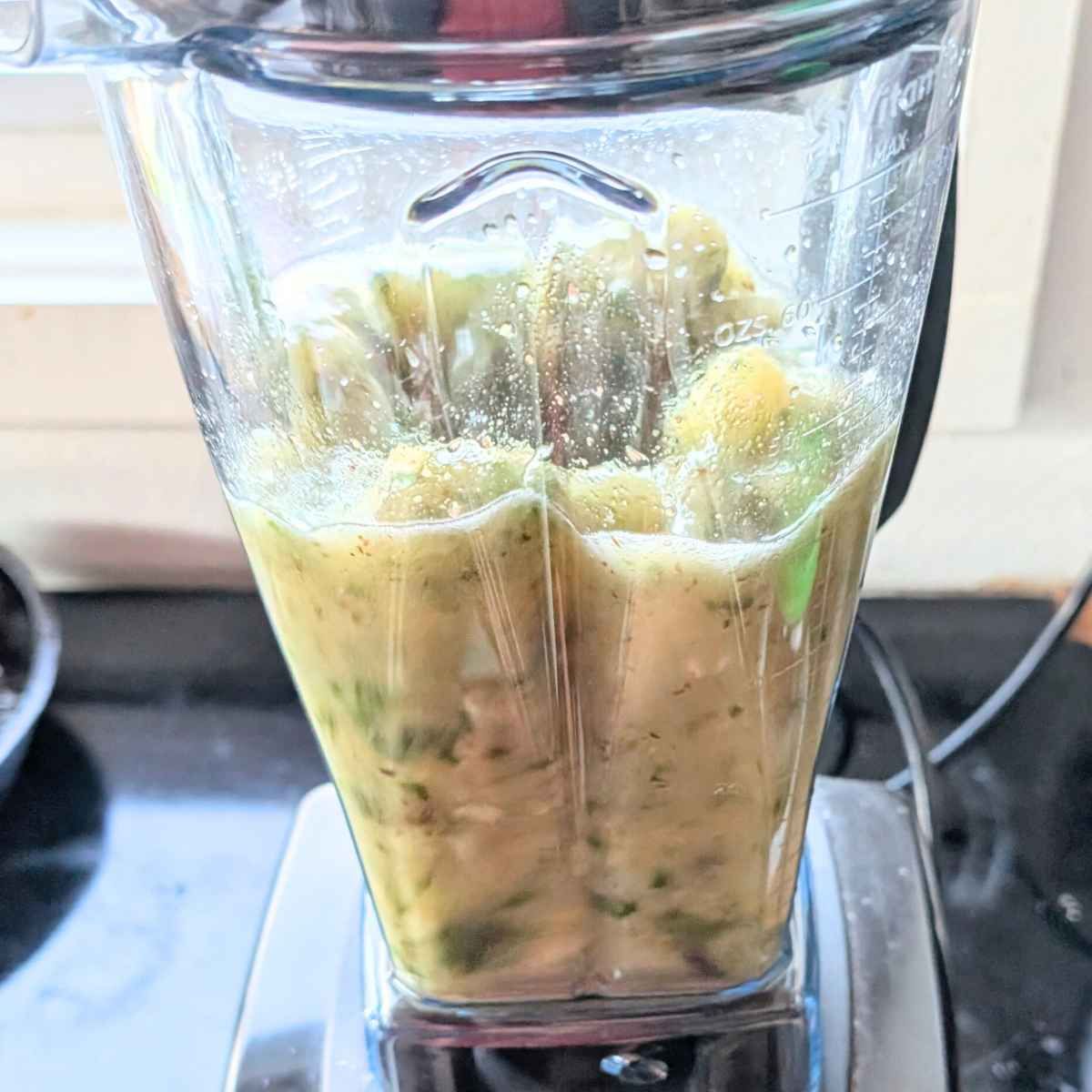 vitamix blender with a rocket smoothie with arugula for a zesty green smoothie.