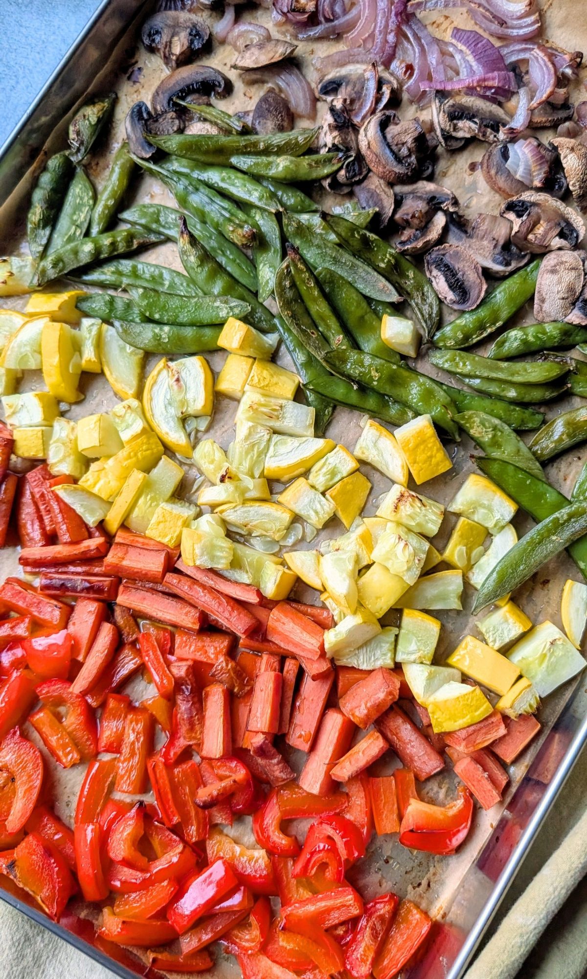 a sheet pan full of vegetables for stir fry baked in the oven