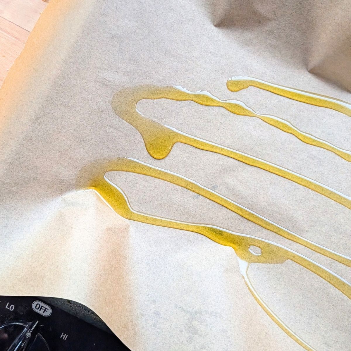 olive oil drizzled over parchment paper for stir fry