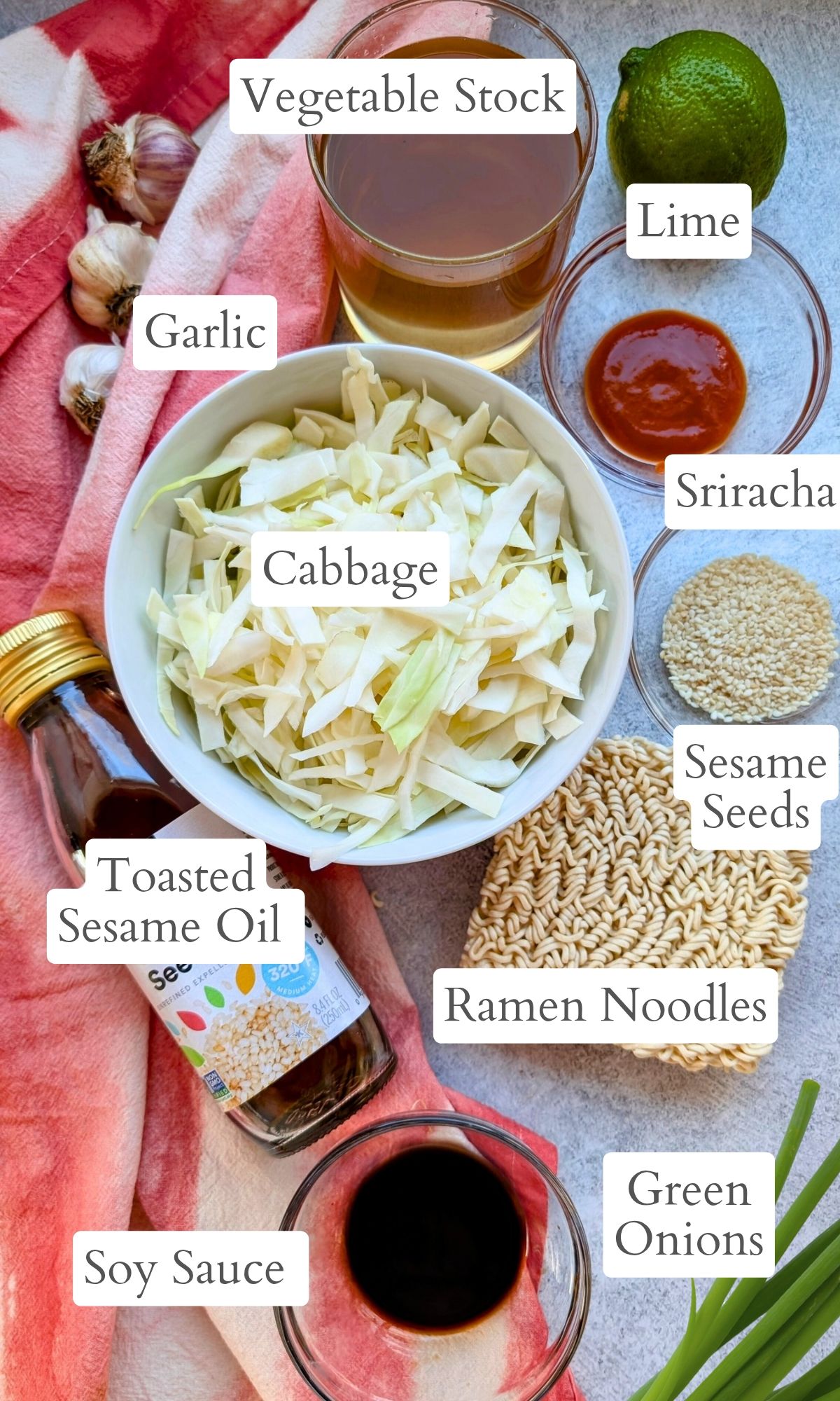 ingredients for cabbage ramen noodles with sesame seeds and sriracha