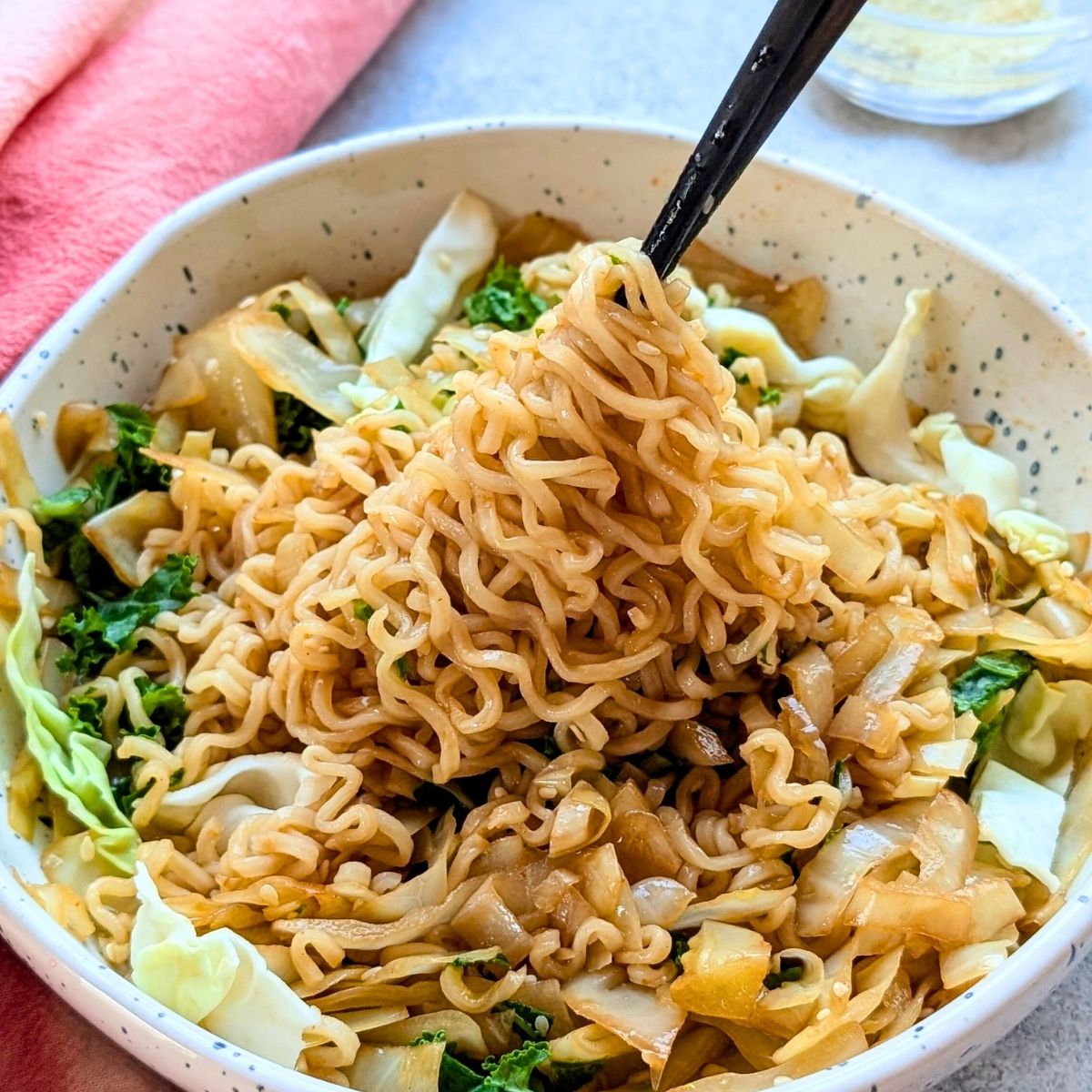 ramen noodles with cabbage green onions sriracha and sesame seeds spicy vegan cabbage ramen soup recipe