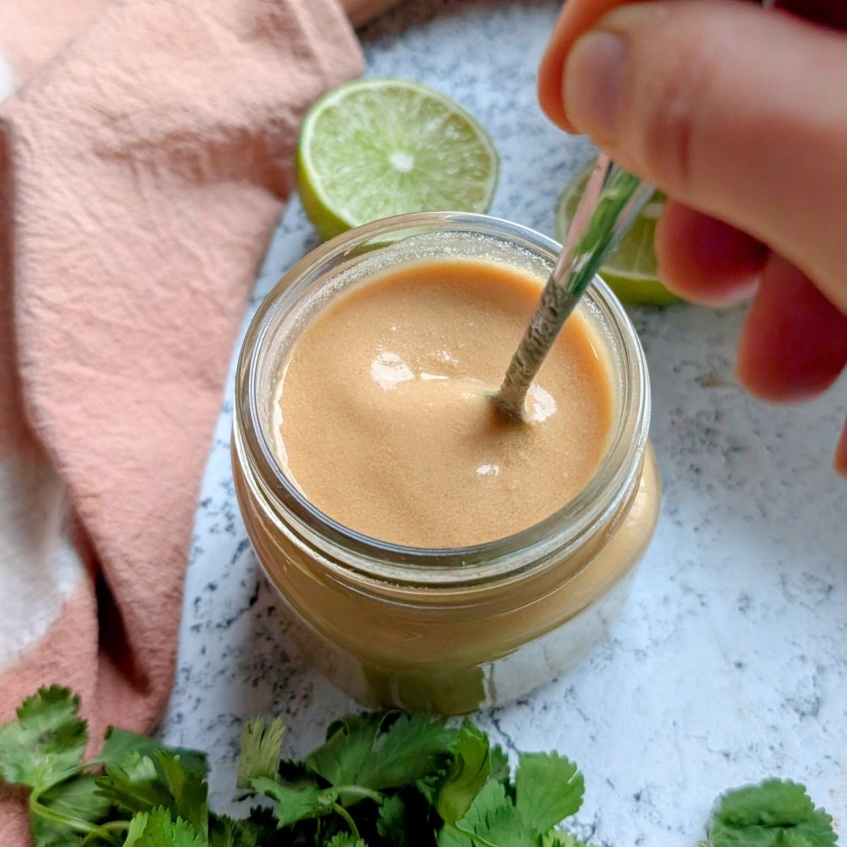 thai peanut sauce dressing mixed in a bowl ready to make crunchy chickpea salad dressing.