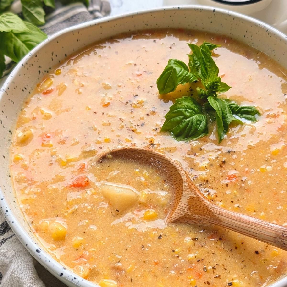 non dairy corn chowder with potatoes and cashews in a pot