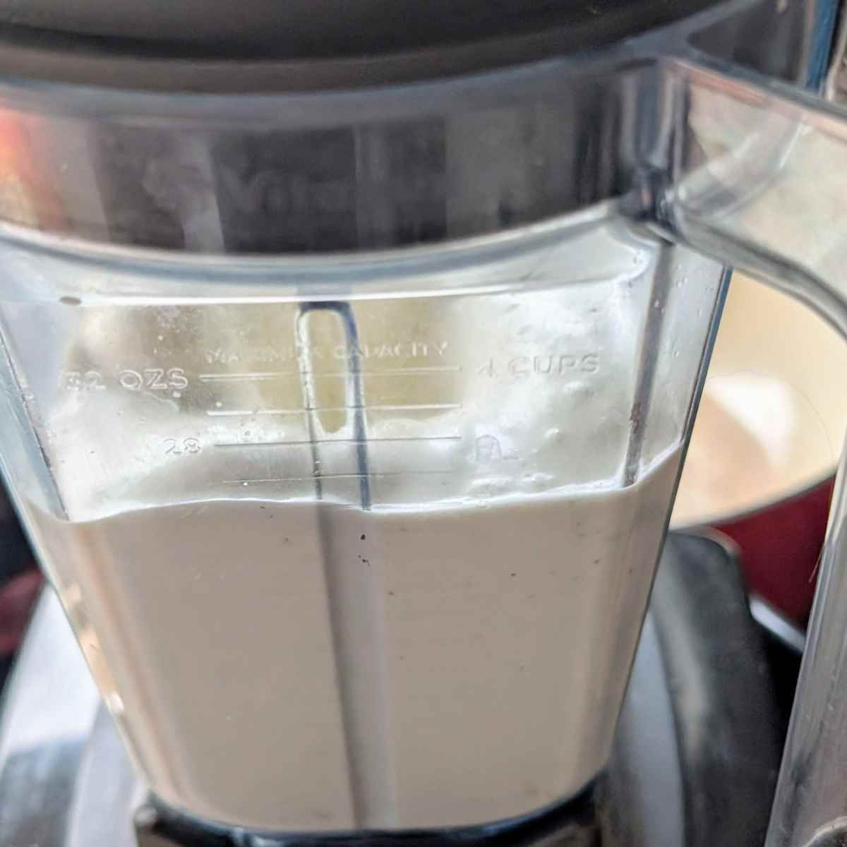a blender of cashews and water to make cashew cream for vegan chowder.
