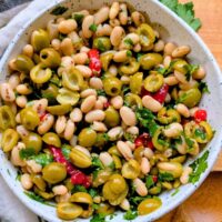 green olive and white bean salad with roasted red peppers and parsley and vinaigrette